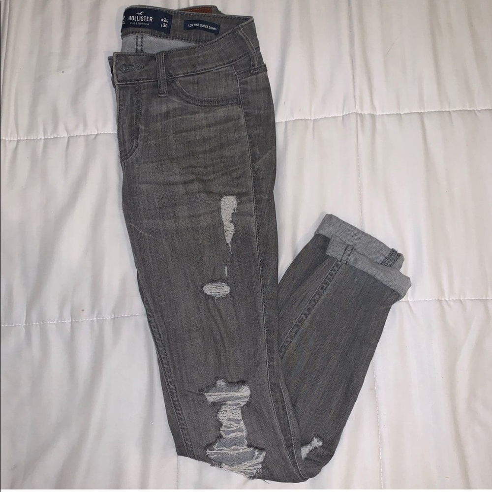 Low Rise Distressed Jeans in a Grey Wash.